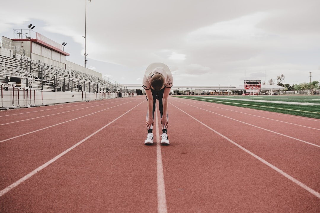 young athlete running on track