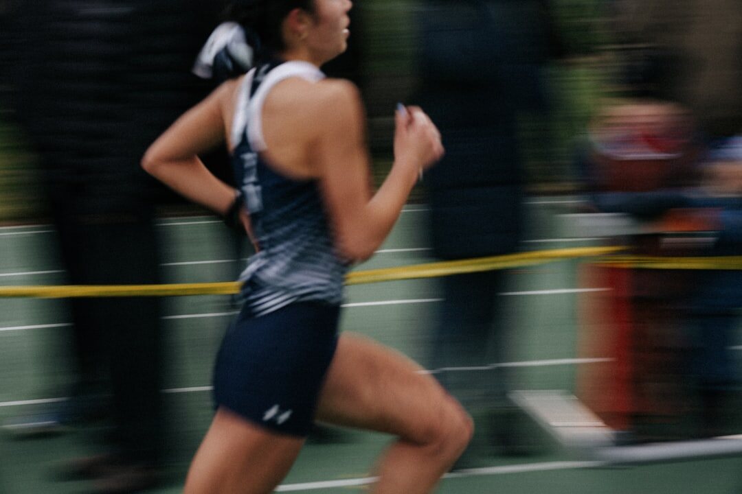 young athlete running on track